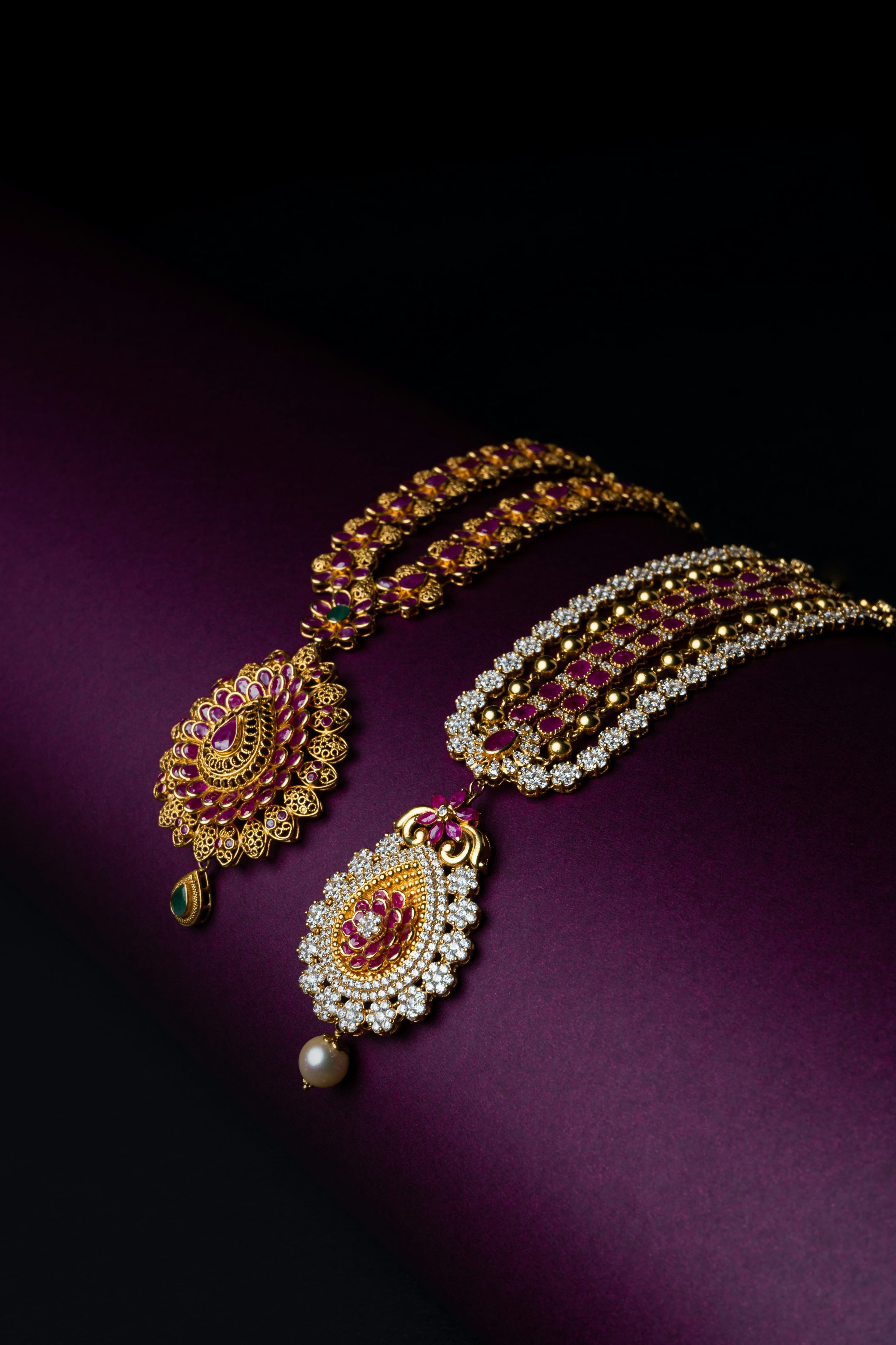 Antique temple gold necklace on purple silk